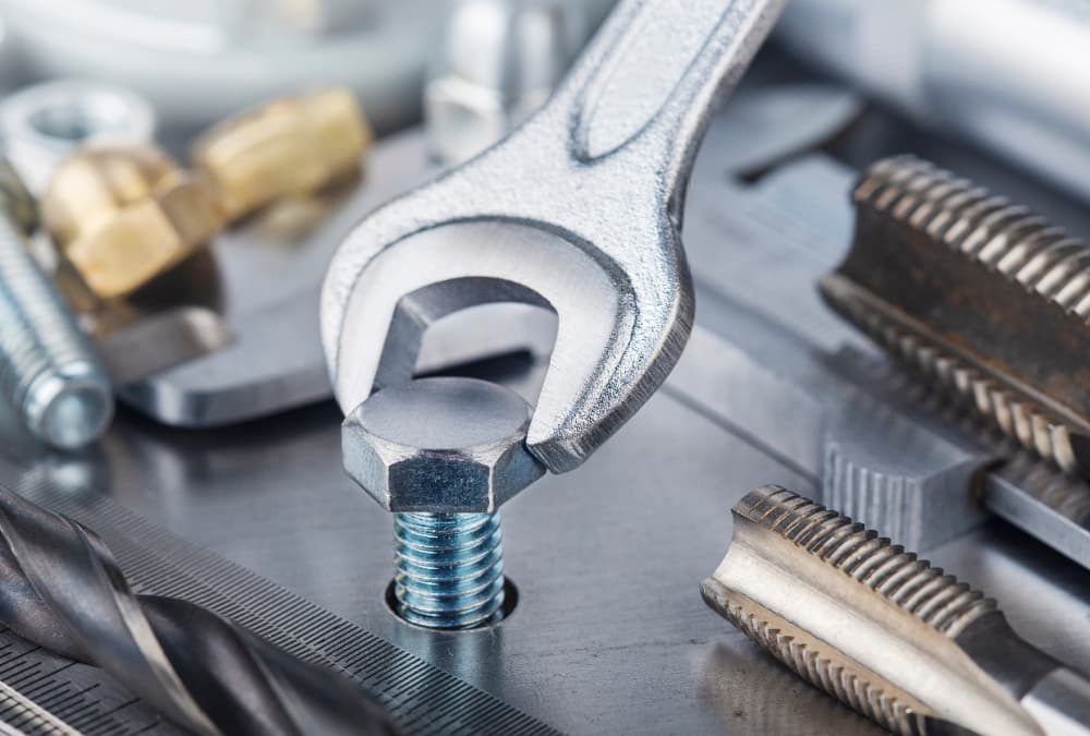 spanner fastening a screw