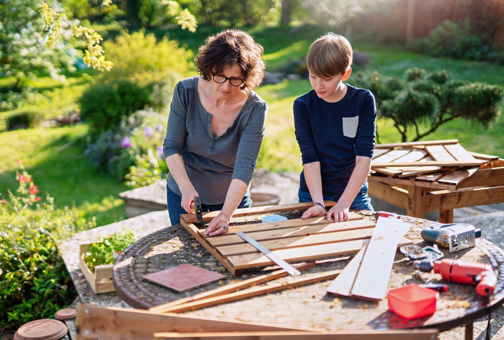 mother and son revamping garden